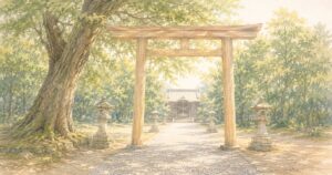 大きな木の下、鳥居ごしに社殿へ続く参道